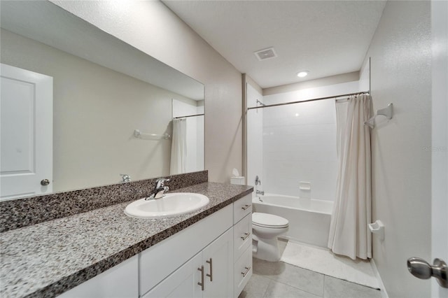 bathroom featuring tile patterned flooring, toilet, visible vents, vanity, and shower / bathtub combination with curtain