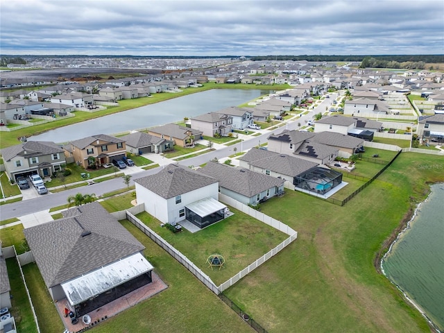 aerial view with a residential view and a water view