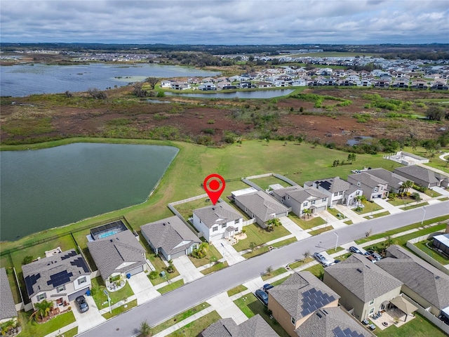 bird's eye view with a water view and a residential view