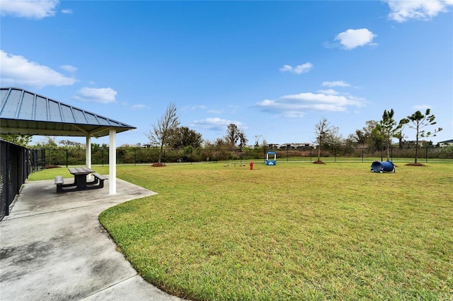 view of yard featuring fence, a gazebo, and a patio