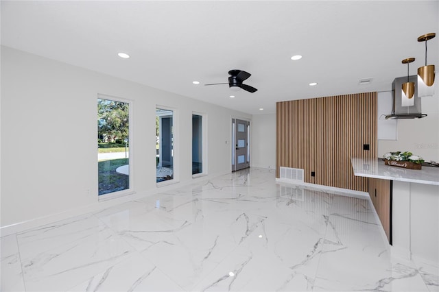 living area featuring a ceiling fan, recessed lighting, marble finish floor, and visible vents