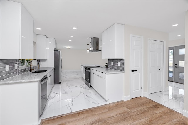 kitchen with stainless steel appliances, white cabinetry, island exhaust hood, and modern cabinets