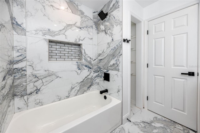 full bathroom with marble finish floor and bathing tub / shower combination