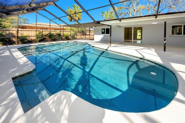 view of pool featuring a lanai, a patio area, and a fenced in pool