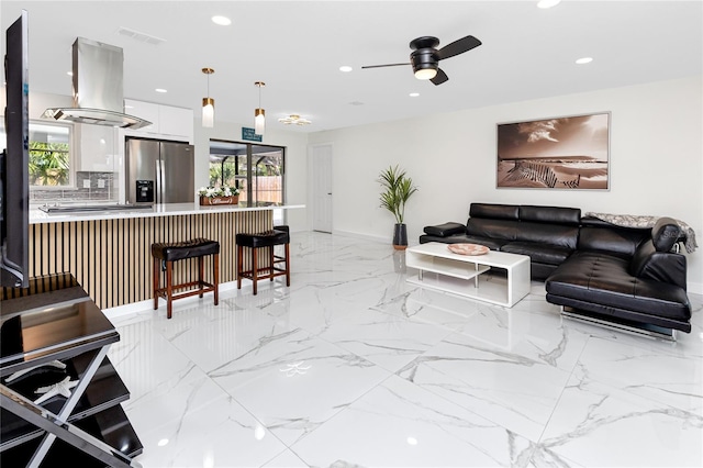 1100 Webb Dr, Clearwater, FL 33755 - living area with recessed lighting, ceiling fan, and light marble finish floors