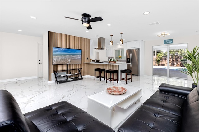 1100 Webb Dr, Clearwater, FL 33755 - living room with light marble finish flooring, recessed lighting, and a ceiling fan