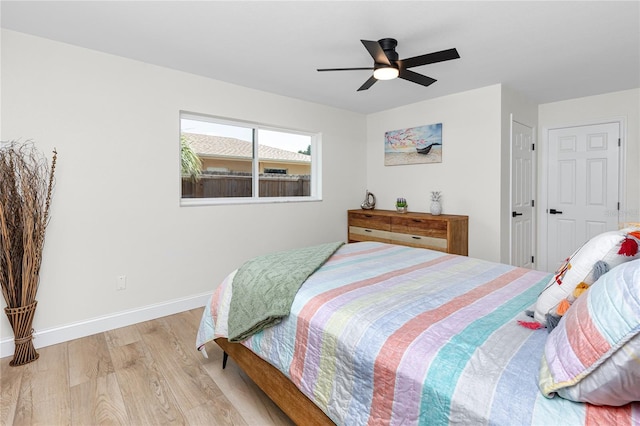1100 Webb Dr, Clearwater, FL 33755 - bedroom featuring light wood finished floors and a ceiling fan