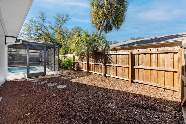 1100 Webb Dr, Clearwater, FL 33755 - fenced backyard featuring a lanai