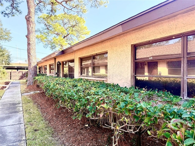 view of property exterior with stucco siding