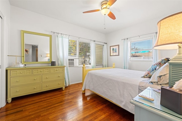 bedroom with ceiling fan and hardwood / wood-style flooring