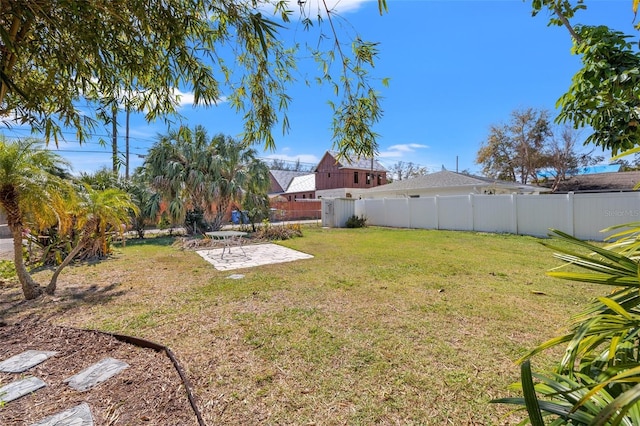 view of yard with a patio area and fence