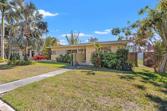 view of front of property with fence and a front yard