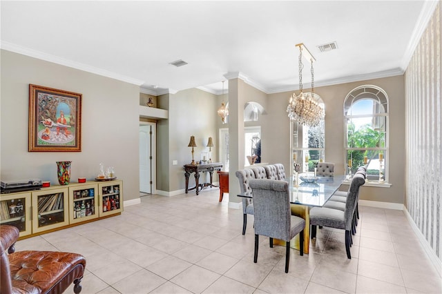 dining space featuring light tile patterned floors, baseboards, visible vents, and ornamental molding