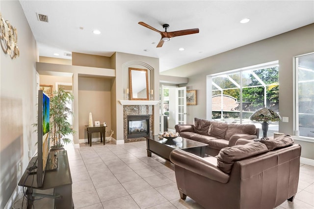 living area featuring recessed lighting, visible vents, a fireplace, and light tile patterned floors