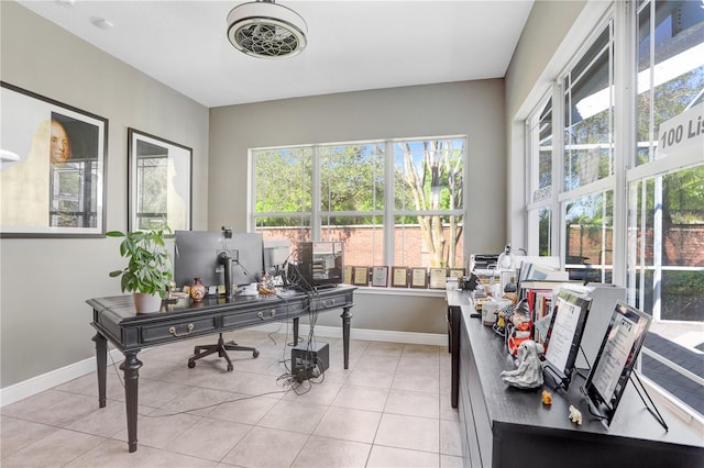 home office featuring light tile patterned flooring and baseboards