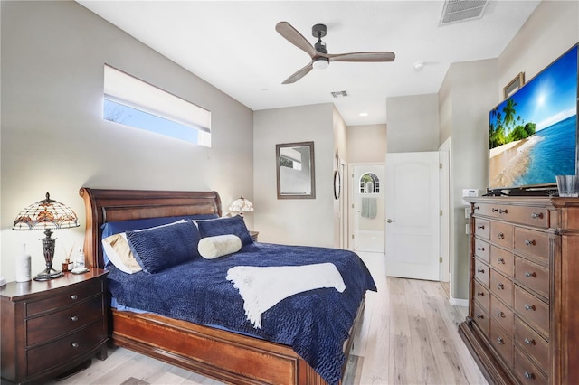 bedroom featuring light wood-type flooring, visible vents, and ceiling fan