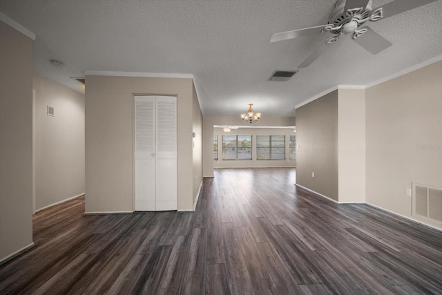 unfurnished room featuring dark wood-type flooring, visible vents, and crown molding