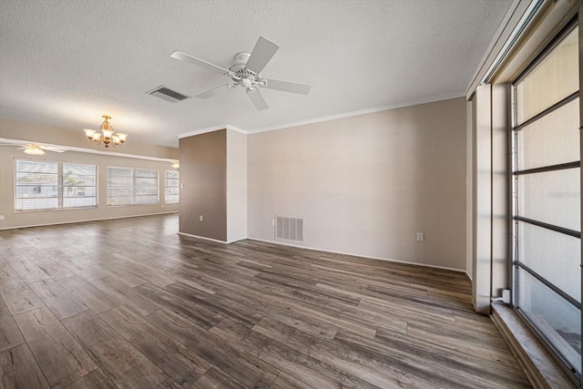 empty room with a textured ceiling, visible vents, dark wood-style flooring, and ceiling fan with notable chandelier