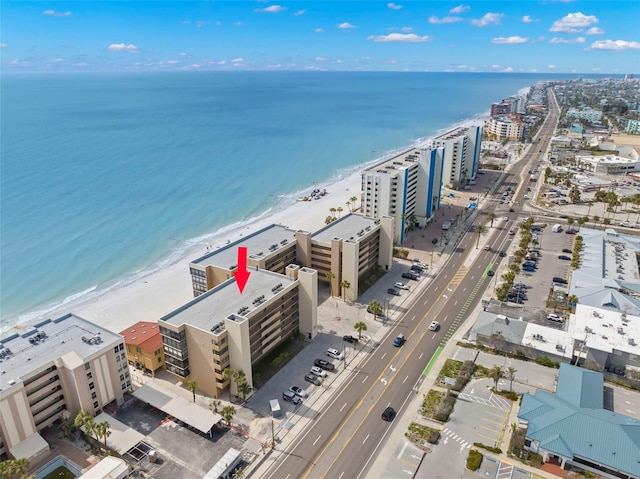 aerial view featuring a view of city, a water view, and a view of the beach