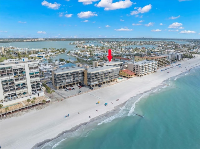 birds eye view of property featuring a view of city, a beach view, and a water view