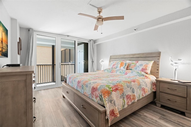 bedroom featuring access to exterior, ceiling fan, and wood finished floors