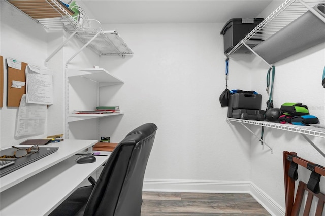 spacious closet featuring wood finished floors