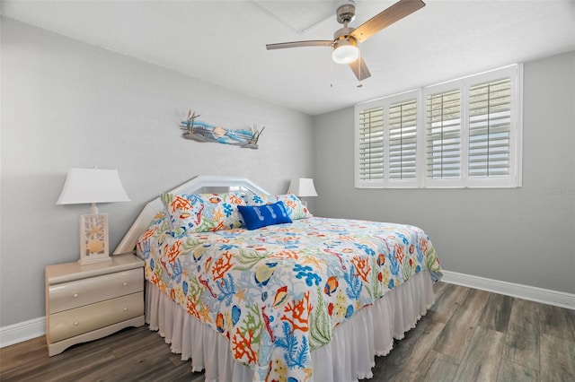 bedroom with a ceiling fan, baseboards, and wood finished floors