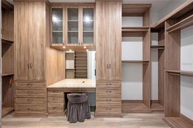 walk in closet with built in desk