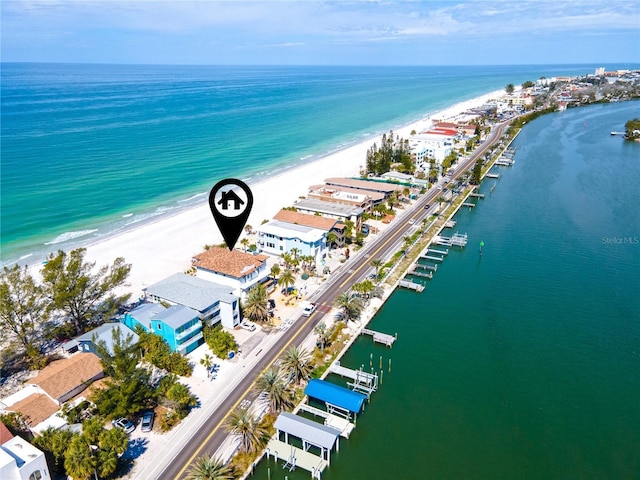 aerial view with a water view and a view of the beach