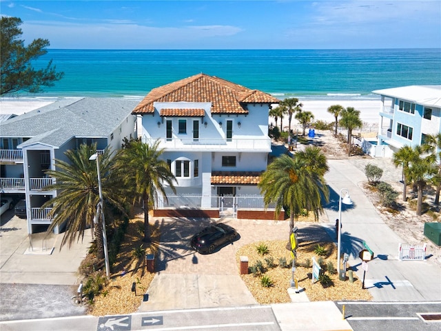 aerial view with a water view and a view of the beach