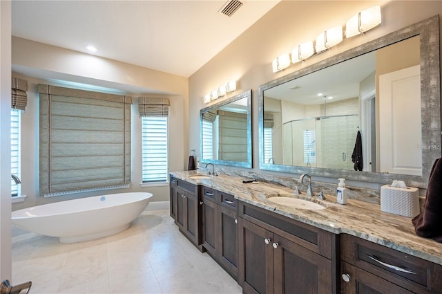 full bathroom featuring a stall shower, a soaking tub, a sink, and visible vents