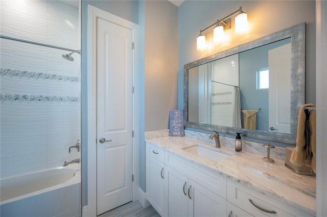 full bathroom featuring shower / bath combination and vanity