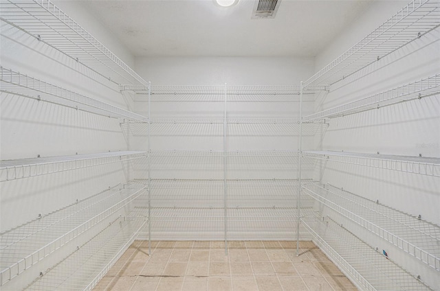 spacious closet featuring tile patterned flooring and visible vents