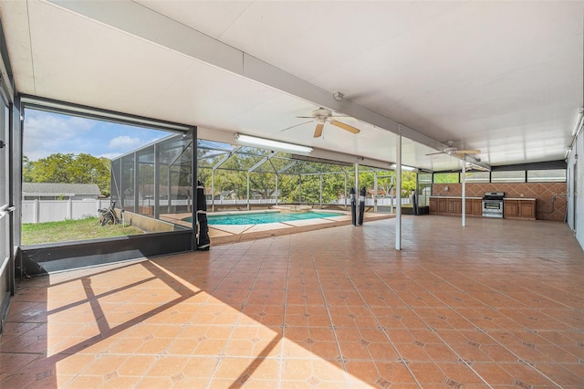 unfurnished sunroom featuring ceiling fan