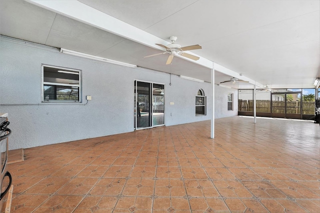 view of patio with a ceiling fan and fence