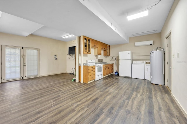 kitchen featuring water heater, an AC wall unit, white appliances, and dark wood-type flooring