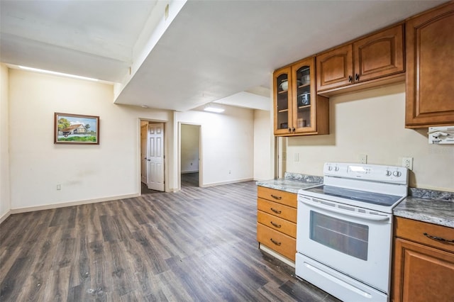 kitchen featuring dark wood-style flooring, brown cabinets, white electric range, glass insert cabinets, and baseboards