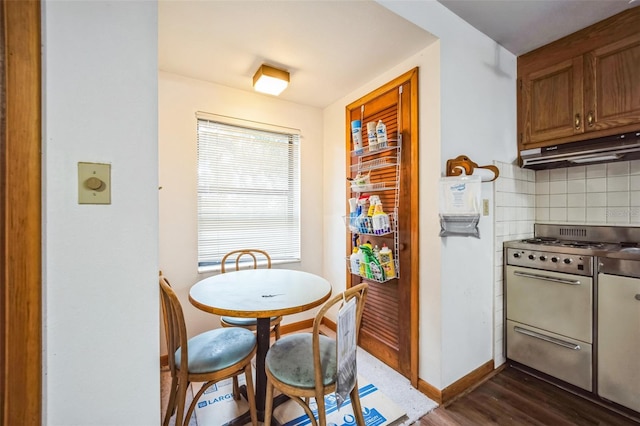 dining space with dark wood-style floors and baseboards