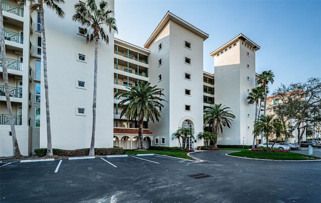 view of property featuring uncovered parking