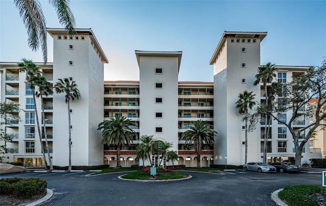 view of property with uncovered parking