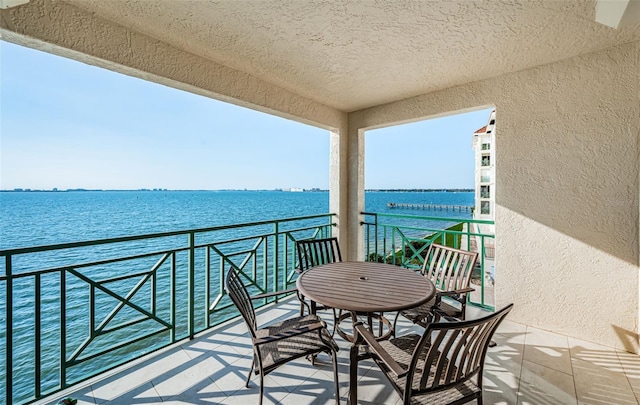 balcony featuring a water view