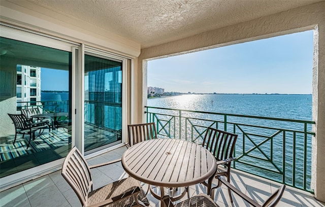 balcony featuring a water view