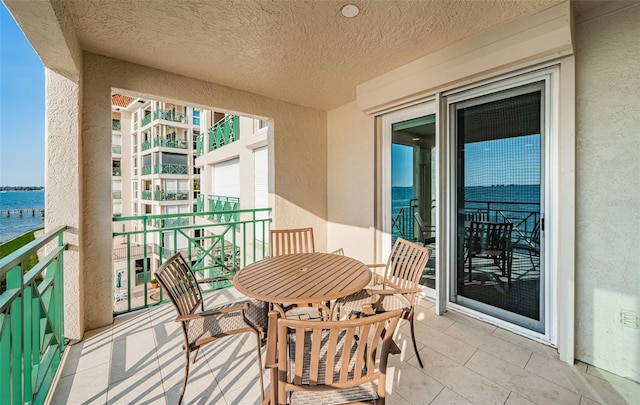 balcony featuring a water view