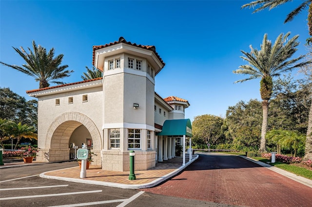 view of building exterior featuring uncovered parking