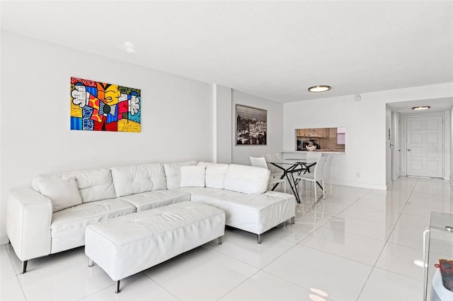 living area with light tile patterned floors