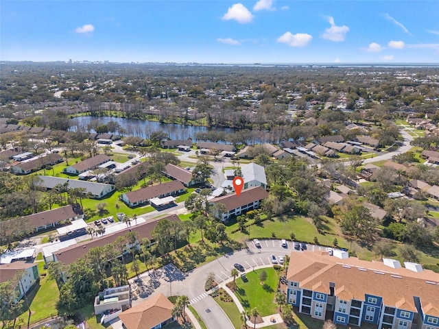 birds eye view of property featuring a water view and a residential view