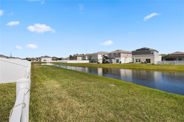 view of water feature with fence and a residential view