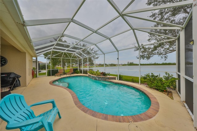 outdoor pool with a water view, glass enclosure, grilling area, and a patio