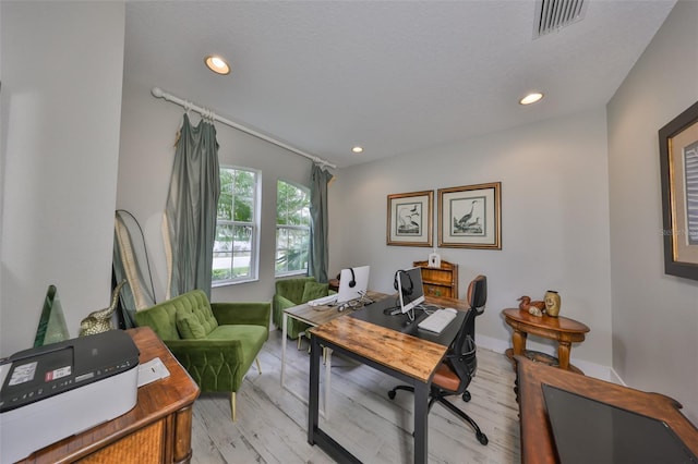 home office featuring light wood-style flooring, visible vents, and recessed lighting