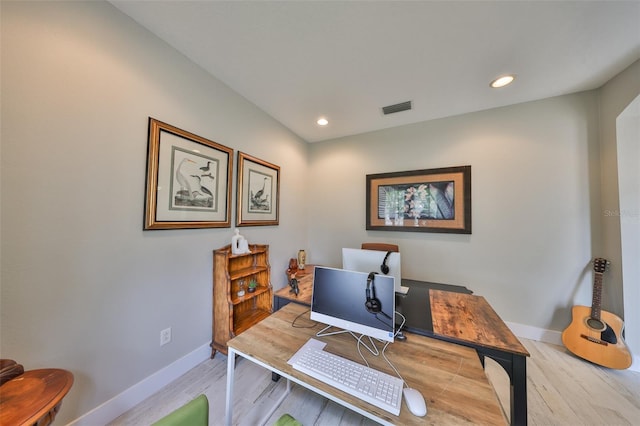 office area featuring light wood finished floors, baseboards, visible vents, and recessed lighting